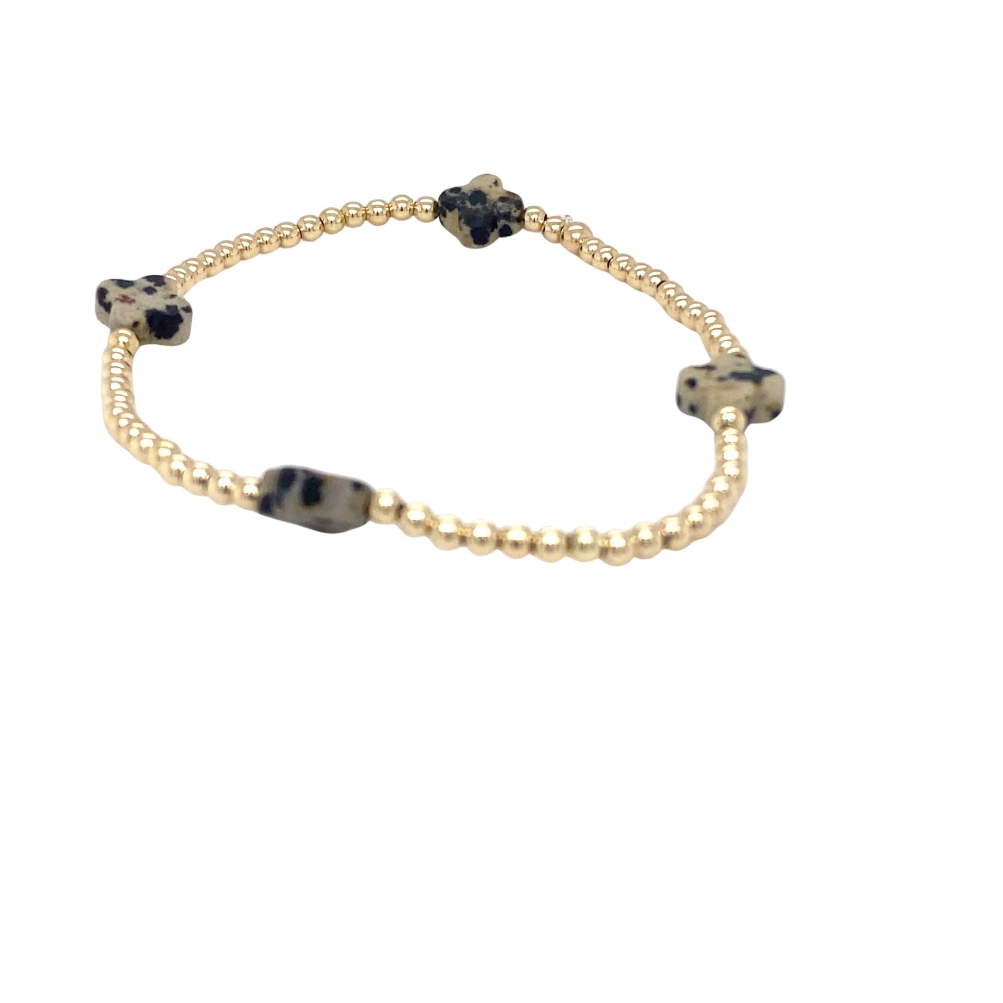 Gouden bolletjes armband met dalmatian klavers