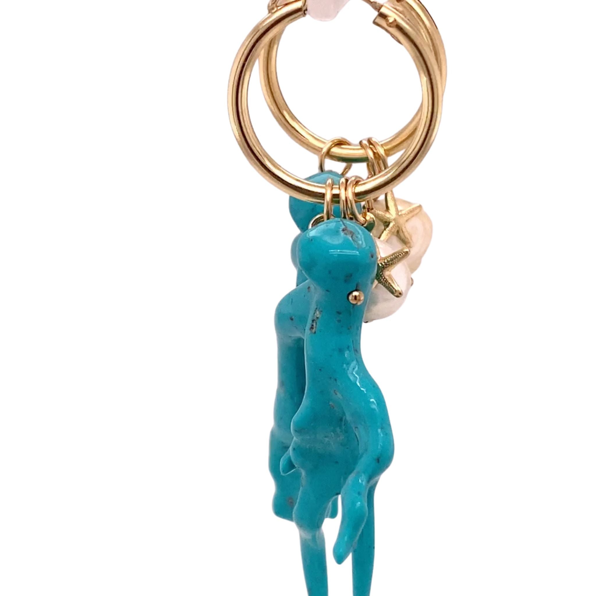 Statement Oorbellen met turquoise koraal hanger