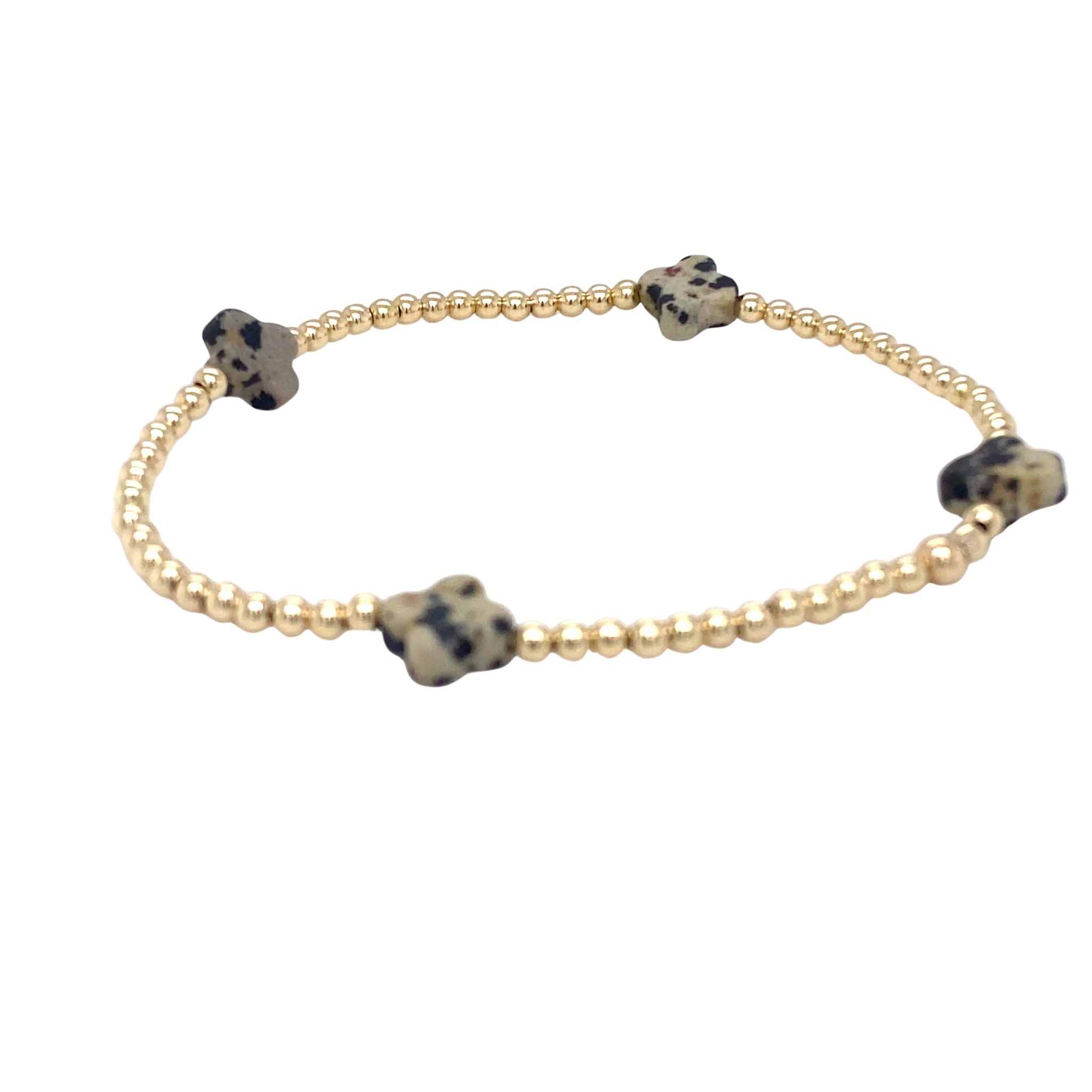Gouden bolletjes armband met dalmatian klavers